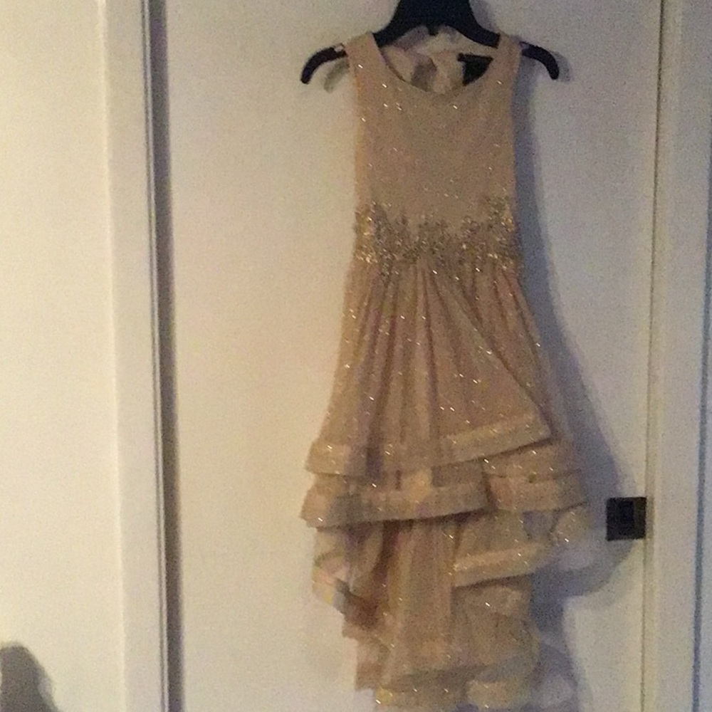 Beautiful gold high low formal girls dress.